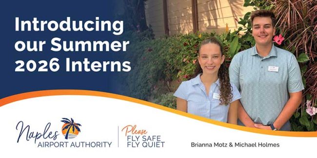 NAA-Internship Two interns, Brianna Motz and Michael Holmes, stand outdoors in front of greenery beside a sign introducing summer 2026 interns for Naples Airport Authority.